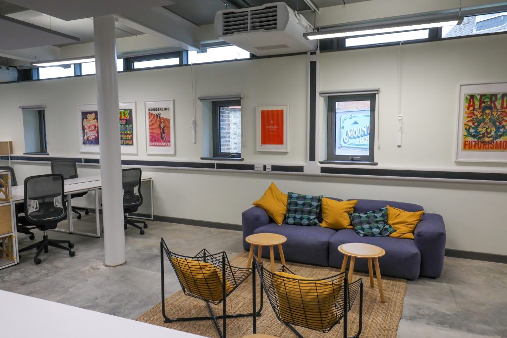 A sofa and lounge chairs