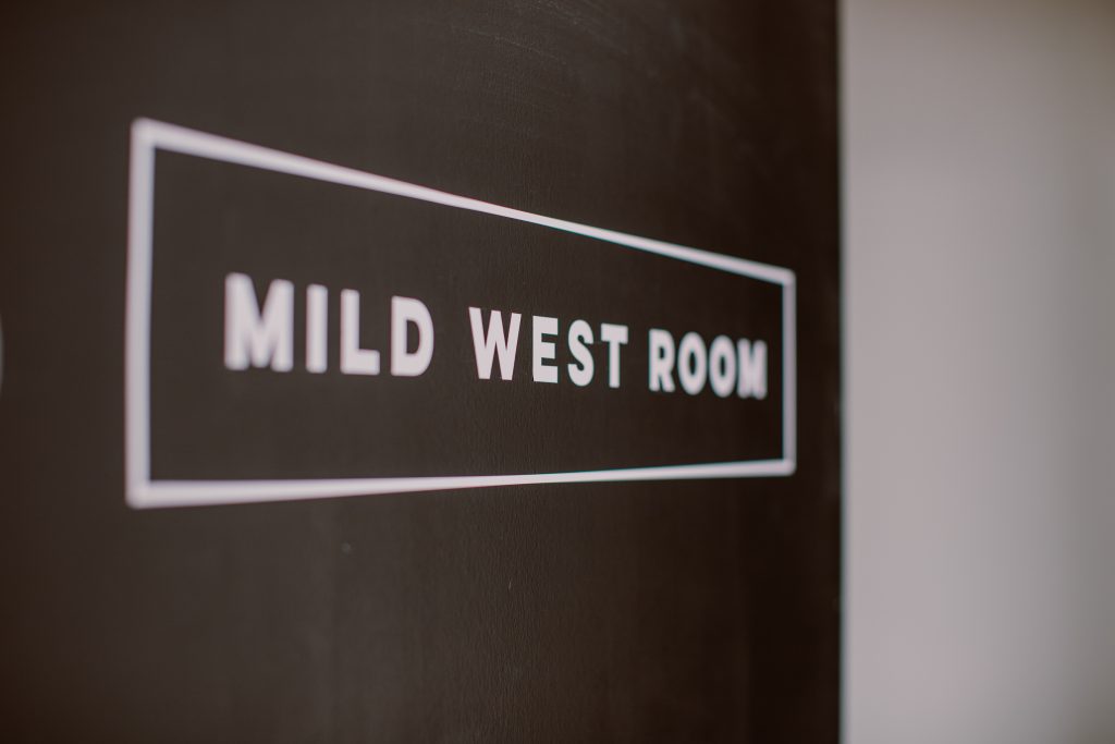 Black signage with white text