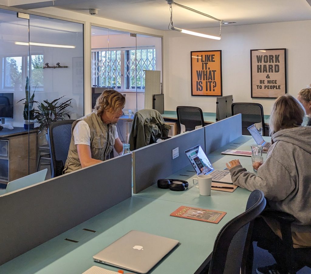 People sat in a coworking space.