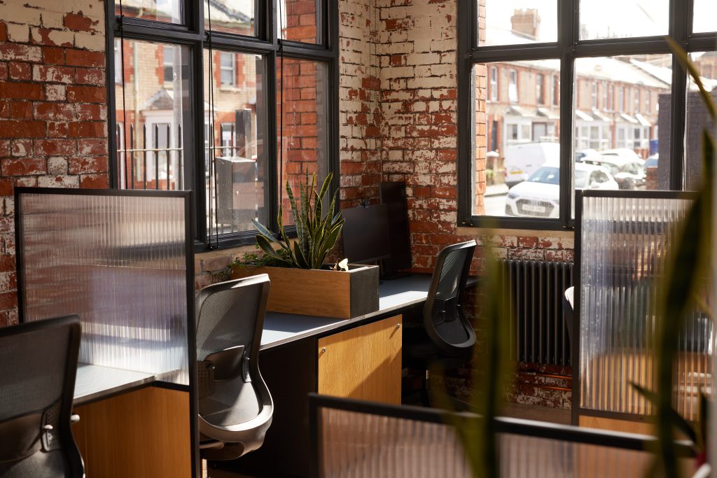 Sunlight on desks in an office space with large windows