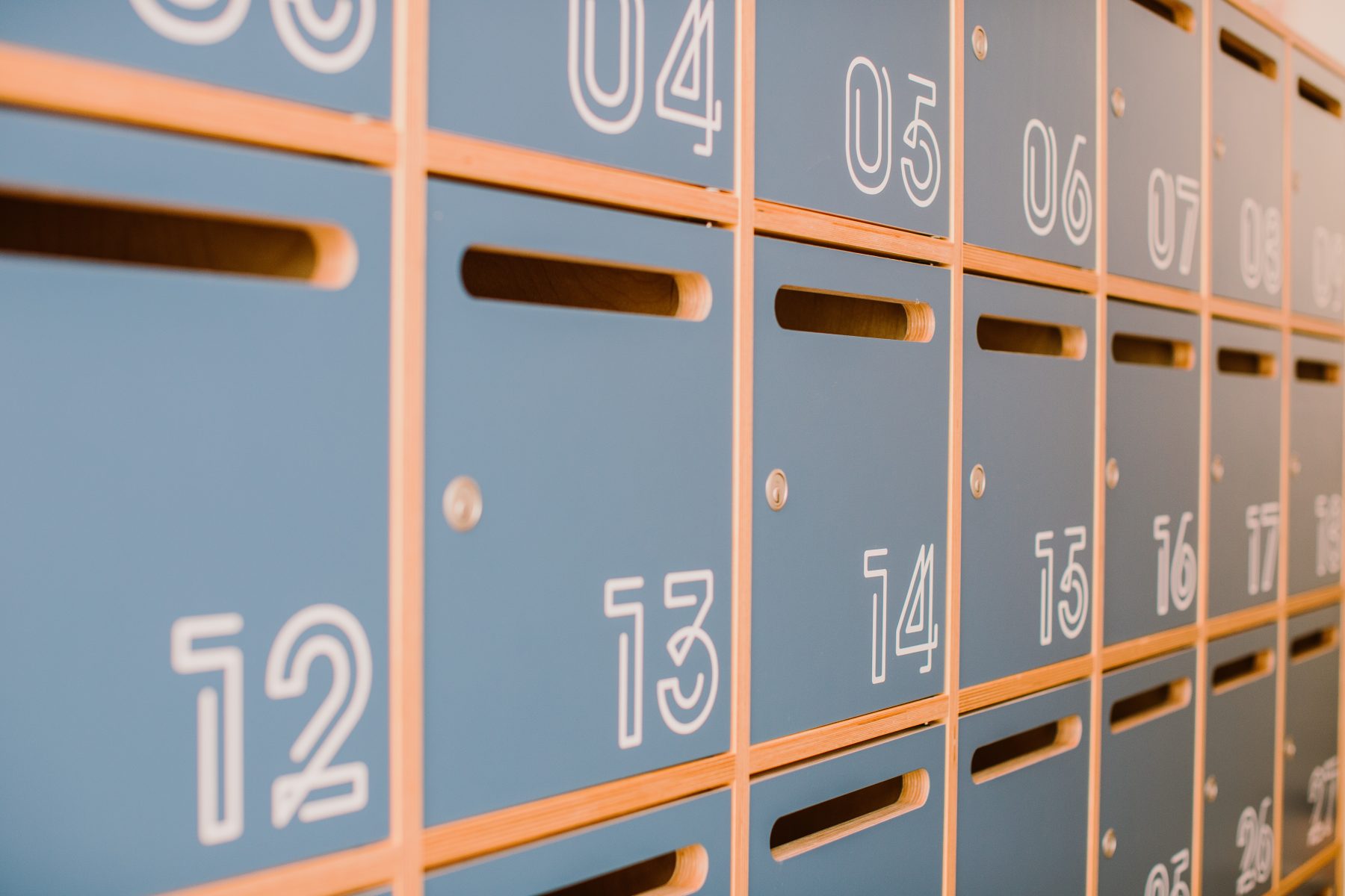 Rows of numbered wooden post boxes